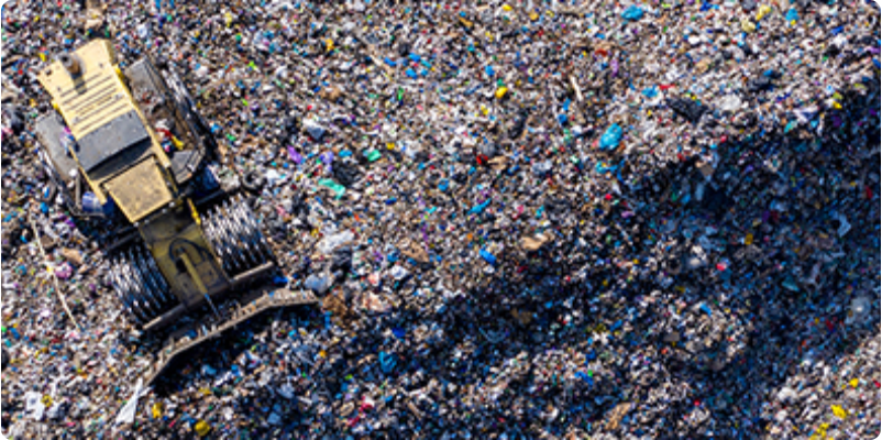 Top view of landfill and bulldozer